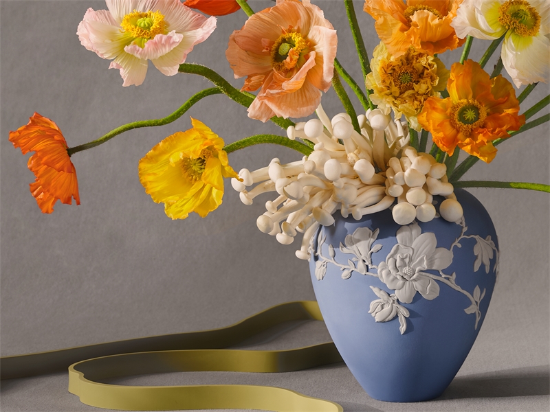 Wedgwood Blue vase with colourful flowers